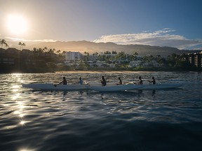With the sun rising over Maui, early morning paddlers pass the Fairmont Kea Lani. The end of the Covid pandemic has seen a number of Wailea resorts, including Kea Lani, to step up their efforts in preserving the island's stunning environment.