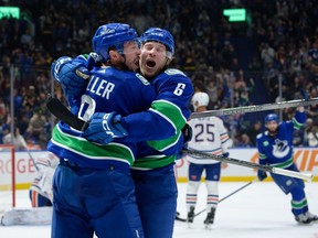VANCOUVER, CANADA - OCTOBER 11: Brock Boeser #6 is congratulated by J.T. Miller #9 of the Vancouver Canucks after scoring a goal during the first period of their NHL game against the Edmonton Oilers at Rogers Arena on October 11, 2023 in Vancouver, British Columbia, Canada.