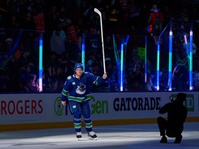 Brock Boeser salutes the Rogers Arena crowd after scoring four goals in an 8-1 romp over Edmonton on Wednesday.