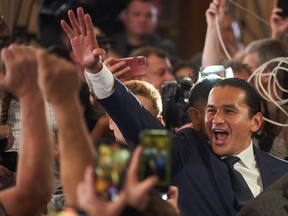 Manitoba NDP Leader Wab Kinew greets supporters after winning the Manitoba provincial election in Winnipeg on Tuesday, Oct. 3, 2023.