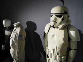 An imperial Stormtrooper costume, right, from the 1977 film "Star Wars, Episode IV, A New Hope," sits on display by other items of the Greg Jein collection at Heritage Auctions, Aug. 30, 2023, in Irving, Texas.