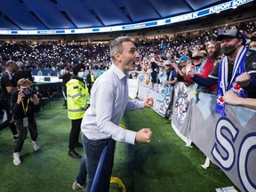 Vanni Sartini celebrates after Vancouver qualified for the playoffs after a 1-1 Decision Day draw with the Seattle Sounders at B.C. Place in 2021. He signed a contract extension this week to remain as Whitecaps head coach for another two years.