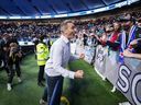 Vanni Sartini celebrates after Vancouver qualified for the playoffs after a 1-1 Decision Day draw with the Seattle Sounders at B.C. Place in 2021. He signed a contract extension this week to remain as Whitecaps head coach for another two years.