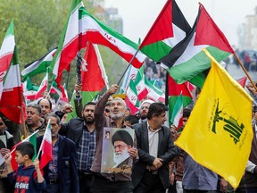 Iranians take part an anti-Israeli rally to show their solidarity with Palestinians in the capital Tehran on Oct. 13, 2023. Thousands of Iranians took to the streets of Tehran on Friday in a show of support for Hamas.