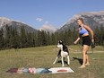 Jessica Gilpin and dog, Django, react to the sight of a nearby black bear.