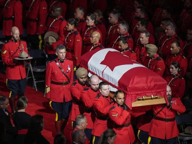 Pallbearers carry RCMP Const. Rick O'Brien's casket into a regimental funeral in Langley, B.C., on Wednesday, October 4, 2023. O'Brien, 51, was killed last month while executing a search warrant at a home in Coquitlam.
