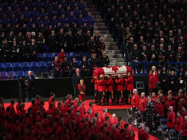 Pallbearers carry RCMP Const. Rick O'Brien's casket into a regimental funeral in Langley, B.C., on Wednesday, October 4, 2023. O'Brien, 51, was killed last month while executing a search warrant at a home in Coquitlam.