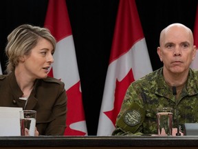 Minister of Foreign Affairs Melanie Joly speaks with Chief of the Defence Staff Wayne Eyre during a news conference concerning the situation in Israel, Wednesday, October 11, 2023 in Ottawa.