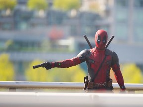 Character from the movie Deadpool, starring Ryan Reynolds, is seen running and jumping over cars on the Georgia viaduct in Vancouver, B.C., April 7, 2015.