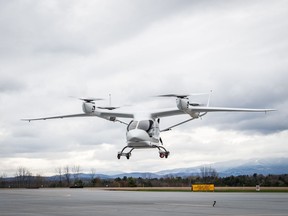 Beta Technologies' Alia A250 eVTOL, an electric vertical takeoff and landing aircraft, performs a test flight at the Burlington International Airport in South Burlington, Vermont in this April 2023, handout photo. A British Columbia helicopter airline says it's placed Canada's first order for an electric vertical-takeoff aircraft to add to its passenger and cargo fleet.