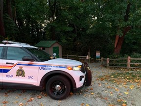 An RCMP vehicle is parked at the top of Trail 3 leading to Wreck Beach on Monday, October 23, 2023.