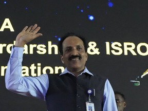 FILE- Indian Space Research Organization (ISRO) Chairman S. Somanath arrives to address the media after the successful landing of spacecraft Chandrayaan-3 on the moon, in Bengaluru, India, Wednesday, Aug. 23, 2023. India successfully carried out Saturday, Oct. 21, the first of a series of key test flights after overcoming a technical glitch ahead of its planned mission to take astronauts into space by 2025, Somanath said.