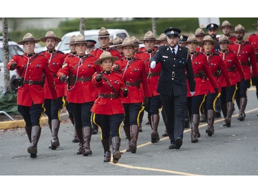 Approximately 5000 RCMP, police, military and emergency services personnel attend the funeral for slain RCMP member Const. Rick O'Brien, at the Langley Events Centre in Langley, BC Wednesday, October 4, 2023.