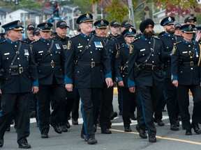 Surrey Police Service officers march during the funeral for murdered RCMP Const. Rick O'Brien.