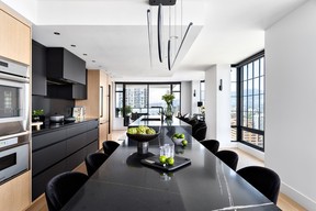 Accentuating the natural light from the expansive windows and creating unimpeded views from everywhere on the main living level was the inspiration of the redesign for this two-storey condo.