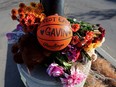 A memorial has been set up at 5009 Ellerslie Road following the targeted shooting death of Harpreet Uppal, 41, and his 11-year-old son Gavin.