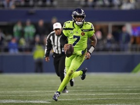 Seattle Seahawks quarterback Geno Smith scrambles during the second half of an NFL football game against the San Francisco 49ers, Thursday, Nov. 23, 2023, in Seattle.