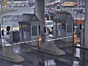 In this image taken from security video, a vehicle, top centre, flies over a fence into the Rainbow Bridge customs plaza on Wednesday.