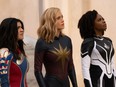 From left, Iman Vellani as Ms. Marvel, Brie Larson as Captain Marvel, and Teyonah Parris as Captain Monica Rambeau in The Marvels.