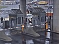 In this image taken from security video, a light colored vehicle, top center, flies over a fence into the Rainbow Bridge customs plaza, Wednesday, Nov. 22, 2023, in Niagara Falls, N.Y.