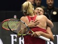 Gabriela Dabrowski and Leylah Fernandez celebrate after beating Barbora Krejcikova and Katerina Siniakova during the semifinal doubles match at the Billie Jean King Cup in La Cartuja stadium in Seville on November 11, 2023.
