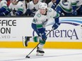 Vancouver Canucks right wing Brock Boeser skates with the puck against the San Jose Sharks during the first period of an NHL hockey game in San Jose, Calif., Thursday, Nov. 2, 2023.