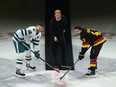 Prince Harry, Duke of Sussex, drops the puck for San Jose Sharks' Tomas Hertl, left, and Vancouver Canucks' Quinn Hughes during a ceremonial faceoff prior to an NHL hockey game in Vancouver, on Monday, November 20, 2023.