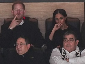 Prince Harry, back left, and Meghan Markle, back right.