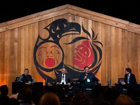 Grand Chief Stewart Phillip, Regional Chief Terry Teegee, Robert Phillips, and B.C. Premier David Eby, left to right, speak during the 2023 B.C. Cabinet and First Nations Leaders' Gathering in Vancouver, on Thursday, Nov. 2, 2023.