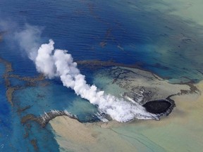 In this aerial photo, smoke billows from the water off the Ioto island, following an eruption in Ogasawara, southern Tokyo, Japan on Oct. 30, 2023. An unnamed undersea volcano, located about 1 kilometer (half a mile) off the southern coast of Iwo Jima, which Japan calls Ioto, started its latest series of eruptions on Oct. 21.