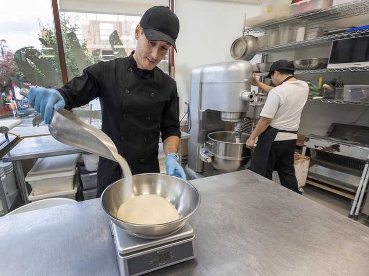  Executive pastry chef Thibault Champel pours sugar inside To Live For Bakery & Cafe in Vancouver.