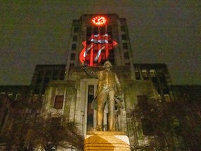 The Rolling Stones logo is projected onto Vancouver City Hall in Vancouver, BC, November 21, 2023.