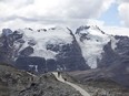 FILE - Tourists walk in front of the Tuco glacier in Huascaran National Park during a tour called the "Route of climate change" in Huaraz, Peru, Aug. 12, 2016. The South American country has lost more than half of its glacier surface in the last six decades, and 175 glaciers became extinct due to climate change between 2016 and 2020, Peruvian scientists from the state agency that studies glaciers said Wednesday, Nov. 22, 2023.