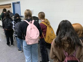 Students lining up for breakfast at Caledonia Secondary where sometimes there is not enough food to go around.