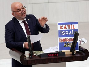 Hasan Bitmez delivers a speech shortly before collapsing at the podium, in the Turkish Grand National Assembly in Ankara on Dec. 12.