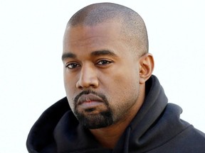 FILE: Kanye West poses before Christian Dior 2015-2016 fall/winter ready-to-wear collection fashion show on March 6, 2015 in Paris.