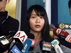 Pro-democracy activist Agnes Chow speaks to reporters after being released on bail at the Eastern Magistrates' Courts in Hong Kong on August 30, 2019.