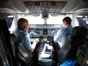 Breeze Airways pilots complete pre-flight checks before the airlines's inaugural flight at Tampa International Airport (TPA) in Tampa, Florida, U.S., on Thursday, May 27, 2021.