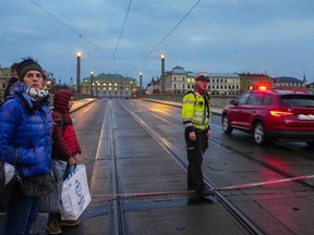 A police officer guards a street after a shooting in downtown Prague, Czech Republic, on Thursday.