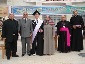 What Omar Mansour misses most about Christmas in the Gaza Strip is the music. Mansour, centre left, poses with his mother and father, second from left, and Father Manuel Musallam, left, and other clergy of the Holy Family School in Gaza at Mansour's graduation in a 2007 handout photo. The last time he was in Gaza with his family on Christmas was 2013.