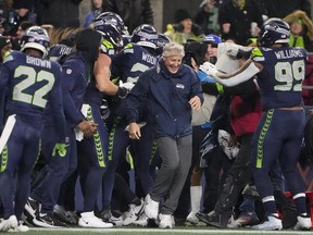 Seattle Seahawks head coach Pete Carroll reacts as players gather during the second half of an NFL football game against the Philadelphia Eagles, Monday, Dec. 18, 2023, in Seattle. The Seahawks won 20-17.