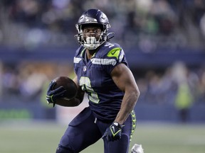 Seattle Seahawks running back Kenneth Walker III runs for a touchdown against the Philadelphia Eagles during the second half of an NFL football game, Monday, Dec. 18, 2023, in Seattle.