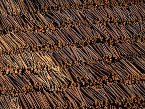 British Columbia is moving to reduce the export of raw logs harvested in the province by requiring that certain types of lumber from the Interior undergo manufacturing. Logs are seen in an aerial view stacked at the Interfor sawmill, in Grand Forks, B.C., on May 12, 2018.