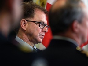 The British Columbia government says it's making progress on a $1 billion, multi-year plan to attract more health-care workers to the province. Health Minister Adrian Dix looks on during a press conference in Victoria, on Nov. 9.
