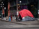 British Columbia's Coroners Service is reporting a sharp increase in deaths among people experiencing homelessness. A tent is seen on the sidewalk on East Hastings Street in the Downtown Eastside of Vancouver, B.C., Thursday, July 28, 2022.
