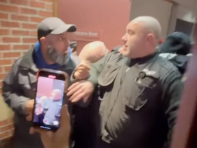 Videos taken from outside the Peel school board meeting show demonstrators surging past security, pushing a large guard into the room.