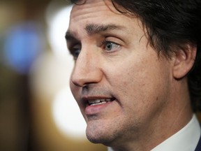 Prime Minister Justin Trudeau speaks to reporters in Ottawa on Dec. 13.