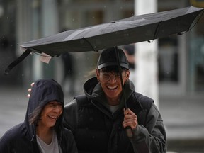 British Columbia's central coast is facing the return of strong winds reaching 90 kilometres an hour just days after the last such warning in the region. A man struggles with an umbrella in the wind as rain falls in Vancouver, on Monday, Sept. 25, 2023.