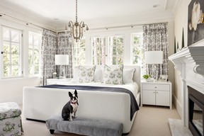McKenney's Boston Terrier, Radish in one of the four bedrooms, furnished with a Namesake bed and bedside tables.