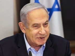 Israeli Prime Minister Benjamin Netanyahu convenes the weekly cabinet meeting at the Defence Ministry in Tel Aviv, Israel, Sunday Jan. 7, 2024.